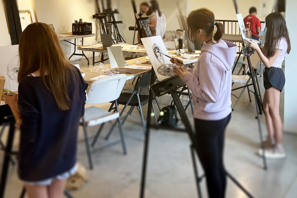 teens-selfportraits Teens drawing on easels at New Art Center in Newton, MA