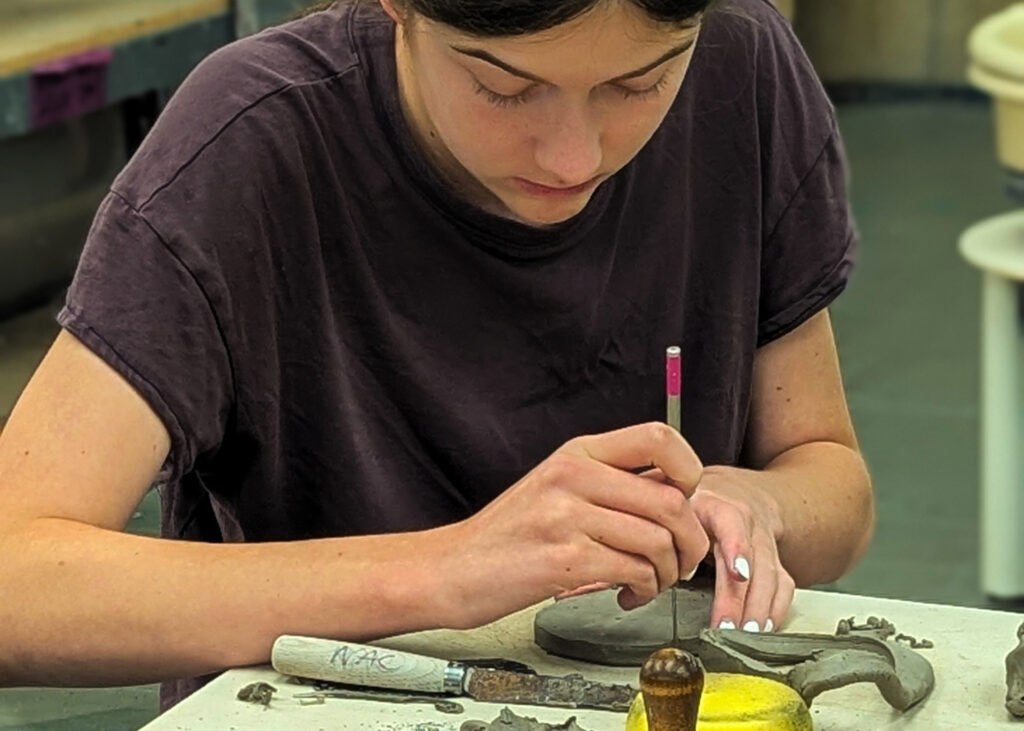 1 Teenager working on sculpting technique at New Art Center in Newton, MA